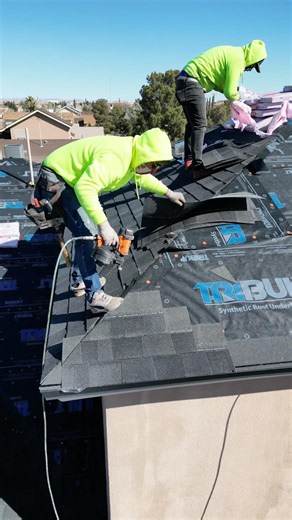 Drone POV: Watch a roofer install shingles on the edge of a two-story roof! 😳 #roofing