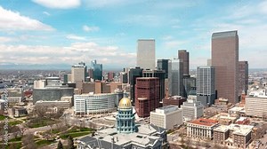 Aerial time lapse circling Denver, Colorado's downtown skyscrapers.