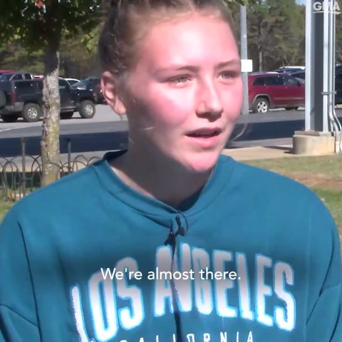 Student helps another runner finish race