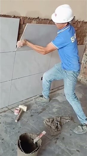 Process of laying tiles on brick interior walls