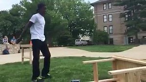 Mike Merchant, a senior in computer science, flips a table to relieve stress from studying for exams. The table flipping is part of a fundraiser for the S&T band programs. Band members will be taking donations for table flips from 11 a.m. to 2 p.m., today through Thursday | Missouri S&T