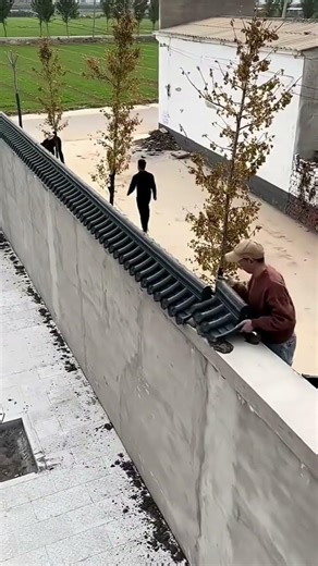 Decorative panels installed on concrete fence for clean look #shorts #construction #coating