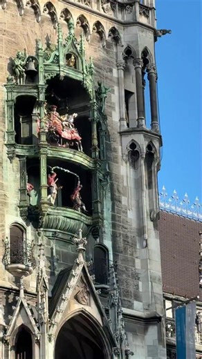 Munich Germany. The Rathaus-Glockenspiel is a large mechanical clock located in the tower of the New Town Hall (Neues Rathaus) in Marienplatz, Munich’s central square. It was installed in 1908 and has since become one of the city’s most beloved attractions. The Glockenspiel consists of 43 bells and 32 life-sized figurines that re-enact two significant historical events from Bavarian history. The performance, which takes place daily, lasts for about 12 to 15 minutes and features music, moving fig