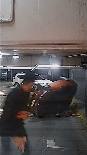 Dramatic moment car flips in Sydney car park when colliding with boom gate