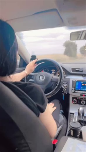 Female Driver Navigates Modern Volkswagen on Rural Roads