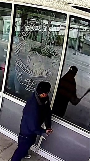 Suspect Tries to Break a Police Station Window