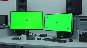 clip-3477273945-man-step-scene-two-computer-monitors-on