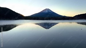 Mount Fuji at sunrise with reflection in Shoji lake, Fuji five lakes, iconic Japanese mountain at dawn, Fujiyama mountain