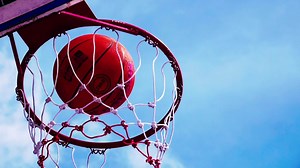 Slow-motion 4X basketball that enters the hoop.