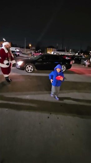 Sidecar Santa and The Grinch passing out gifts