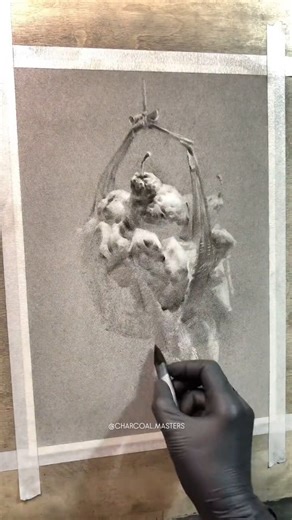 Artist Sketch Champion creates a striking charcoal drawing with dramatic contrasts of light and shadow. The delicate textures and fine tonal gradations give the piece both depth and atmosphere, capturing an intense sense of realism and form. Artist : Sketch Champion (Douyin) #charcoaldrawing #realisticart #fineart #shadingart #hyperrealism #artwatchers | Charcoal Masters