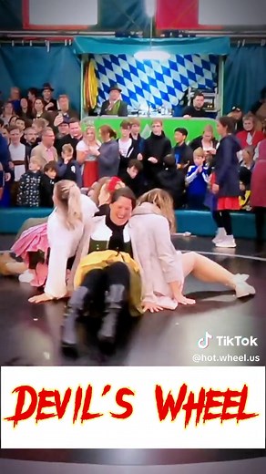 Unplanned Fun at the Festival: Pink Girl's Hilarious Mishap on the Devil's Wheel