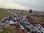 Traffic jams along Turkish-Syrian border as thousands of refugees go back to Syria