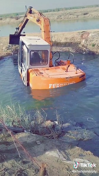 Orange Excavator in Water: Stabilizing Techniques
