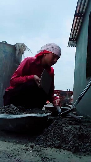 Engaged in Construction Work: Building with Cement Tools