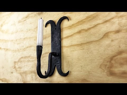 Forging a wall sconce candle holder