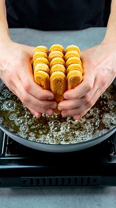 Forget difficult recipes! No-bake dessert, ready in 5 minutes Ingredients sponge fingers: 300 g (11 oz) butter: 100 g (3.5 oz) sugar: 50 g (1.8 oz) cocoa: 40 g (1.4 oz) water: 50 ml (1.7 fl oz) yolks: 2 pc sugar: 30 g (1.1 oz) starch: 50 g (1.8 oz) milk: 200 ml (6.8 fl oz) milk: 600 ml (20 fl oz) sponge fingers: 100 g (3.5 oz) cocoa: 20 g (0.7 oz) ice cubes: 200 g (7.1 oz) vanilla essence: 10 ml (0.3 fl oz) instant coffee: 5 g (0.2 oz) milk: 100 ml (3.4 fl oz) dark chocolate: 100 g (3.5 oz) whip