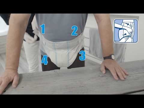 Pose du change complet MoliCare Premium sur patient debout