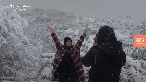 The iconic Acropolis in Athens is covered in snow