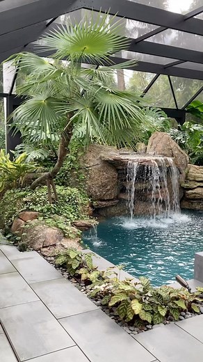 Matthew Giampietro Garden Design on Instagram: "Tropical garden and Natural Rock Waterfall When one company designs and builds the space there is a seamless transition and great level of quality details . . . . . #swimmingpool #pool #pond #garden #gardening #tropical #tropicallandscape #tropicalplants #plants #water #waterfeature #waterfall #watergarden #design #color #texture #leaf #contrast"