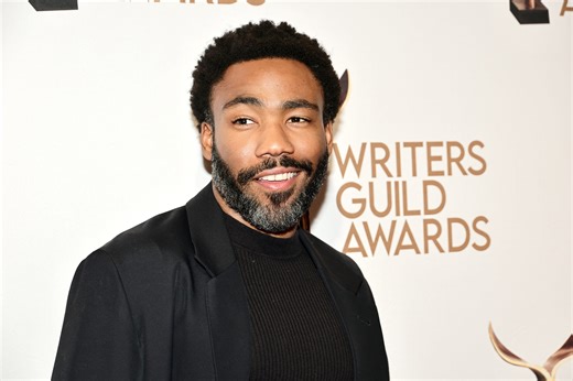 Donald Glover Calls Out Chevy Chase's Use Of The N-Word During Writer's Guild Presentation Speech | Essence