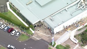 People queue outside Mona Vale Hospital testing clinic
