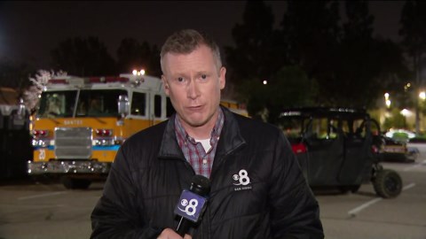 Firefighters monitor aftermath of riverside brush fire that threatened Santee shopping center