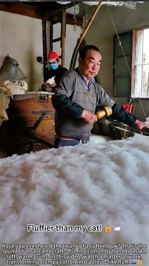 Fluffing cotton with a bow – traditional craft! 🏹✨