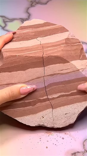 Nikkie Burns on Instagram: "What if Petra collapsed into rose-gold paste right before your eyes? Immediate crack. Dust burst. Grit folds into glowing cream. This isn’t a trick — it’s transformation without a single cut. Golden veins stretch. Rose-red sandstone dissolves. The past smears forward. Follow @nikkie.burns.aus for ASMR carved from ancient weight. Prompt from @iamesme.ai Comment “PROMPT” for the link to her new Vol2 prompt guide. #sandstone #asmr #explore #oddlysatisfying #asmrsounds"