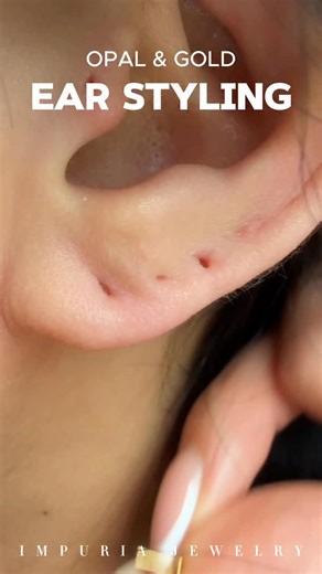 Styling my gold opal ear stack 🤍✨ Do you think opal and gold go well together? 🤔 . . . . . . . . #earpiercings #earrings #piercings #earringsofinstagram #earringstyle #curatedear #earringshop #earringaddict #earringswag #earringstagram #cartilagepiercing #traguspiercing #helixpiercing #jewelry #piercinggirl #daithpiercing #conchpiercing #rookpiercing #earcuration #impuria #love #cute | Impuria Piercing Jewelry