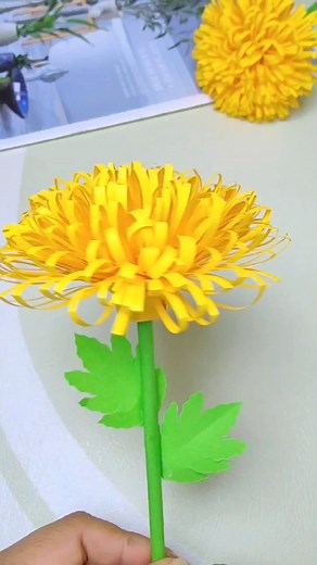 Title: "Blooming Spring: DIY Yellow Paper Flowers" Hashtags: - #DIYFlowers - #SpringCrafts - #YellowPaperCraft - #BloomingSpring - #HandmadeDecor | paper craft