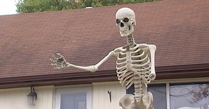 Someone is stealing the arms off of large skeleton Halloween displays