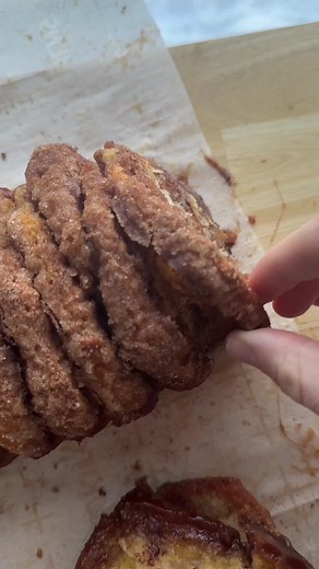cinnamon pull apart bread - Can of biscuits - 3/4 cup sugar - 1 tbsp cinnamon - 1/2 stick of butter melted. Instructions: - Open the biscuits, and split in half so there are now 16 biscuit portions. - mix the sugar, and cinnamon in a shallow bowl, and melt the butter into another bowl. - Dip each piece of biscuit in the butter, and then the cinnamon sugar until full coated. - Stack the biscuits on top of each other, and place sideways into a loaf pan. - Bake at 350 for 35-40 mins until baked thr