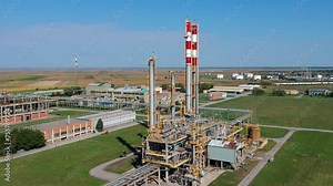Aerial View of Natural Gas Processing Plant. Natural Gas is a Flammable Gas, Consisting Mainly Of Methane (CH4). Drone Point of View on Petrochemical Plant in Agricultural Landscape.