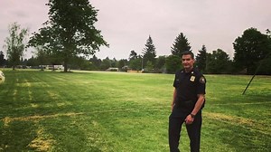 Captain Crebs lends a helping head while coaching the East Portland Community Center World Cup Team at Lynchview Park. | Portland Police Bureau