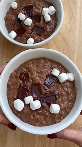 21K views · 80 reactions | Hot Chocolate Oatmeal Bowl Instructions Add oats, cocoa, milk, salt, and vanilla to a medium saucepan. Place the saucepan over low heat and cook for 12-15 minutes, stirring occasionally. Once creamy, remove from heat and stir in the maple syrup. Divide the oatmeal among 4 serving bowls. Garnish with chopped chocolate while still warm. | Healthy Fitness Meals | Facebook