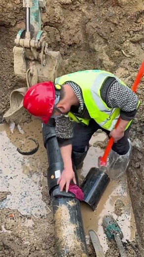 Excavator-Assisted T-Joint Pipe Installation Process