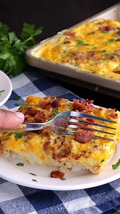 9.6K views · 55 reactions | Sheet Pan Sausage Breakfast Casserole Recipe – an easy, crowd-pleasing breakfast! Crispy hash browns, savory sausage, melty cheddar cheese, and fluffy eggs all baked together in one pan. Perfect for meal prep, holidays, or a lazy weekend brunch. Serve it with fresh fruit, biscuits, or a cup of coffee for a complete breakfast! Full Recipe: https://buff.ly/VwqldRU | Plain Chicken | Facebook