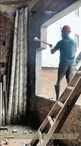 Sledge and Socket: A Worker Knocks Out a Window Opening in a New Wall