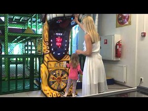 Lady boxing in a white dress. Boxing arcade record - boxing machine challenge