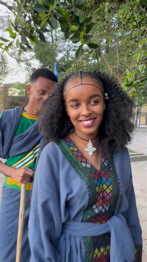 Round Omo Valley tour on Instagram: "From Gonder with style 🇪🇹 Two beauties repping northern Ethiopia in modern-traditional fusion! 👑 Her: intricate braids, statement necklaces, and a dress that speaks elegance for cultural days and special occasions. 👑 Him: bold shorts plastic combs in the hair, a traditional wooden toothbrush, and that iconic long stick—confidence meets heritage. This is how fashion tells stories in Ethiopia—where roots meet rhythm, and every accessory has meaning. Love th