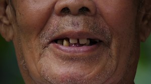 Download Close up of an elderly mouth talking for free