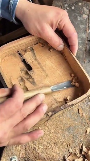 carving out the inner parts of a wooden container to create a smooth hollow shape for a small box