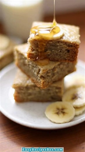 🍌 3-Ingredient Banana Oat Snack Cake 🍰 This is the kind of simple cake I bake when I want something soft and wholesome without overthinking it. It’s tender, lightly sweet, and perfect sliced into squares for an easy afternoon snack. 🍌 INGREDIENTS: Main Ingredients: - 2 ripe bananas, mashed - 1 1/2 cups rolled oats - 1/2 cup milk of choice ... #BananaOatCake #HealthySnack #SimpleBaking | Easy Recipes Box