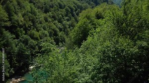 Premcan Bridge on River Tara. Tara river winds its way through dense forests and rolling hills. Premcanski drveni Most na Rijeci tari