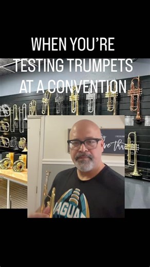 David Champagne on Instagram: "When you’re testing trumpets at a convention . The struggle is real! #trumpet #musiciansofinstagram #repost #music"