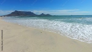 Time lapse of Table Moutain with the ocean in the forground taken with a Gopro Hero 7 Black from Woodbridge Island Beach. Stock Video