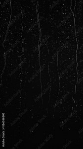 Vertical water rainfall, rain drops falling on window glass on black background