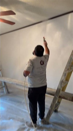 Wetting the ceiling for scraping #construction #remodel #diy