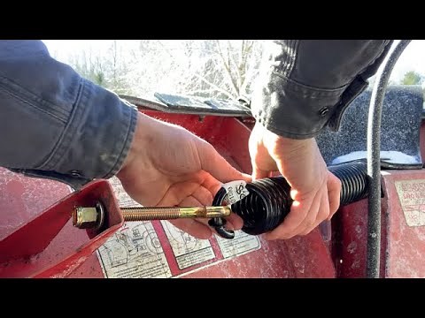 Installing a return spring and blade guides on a boss V plow